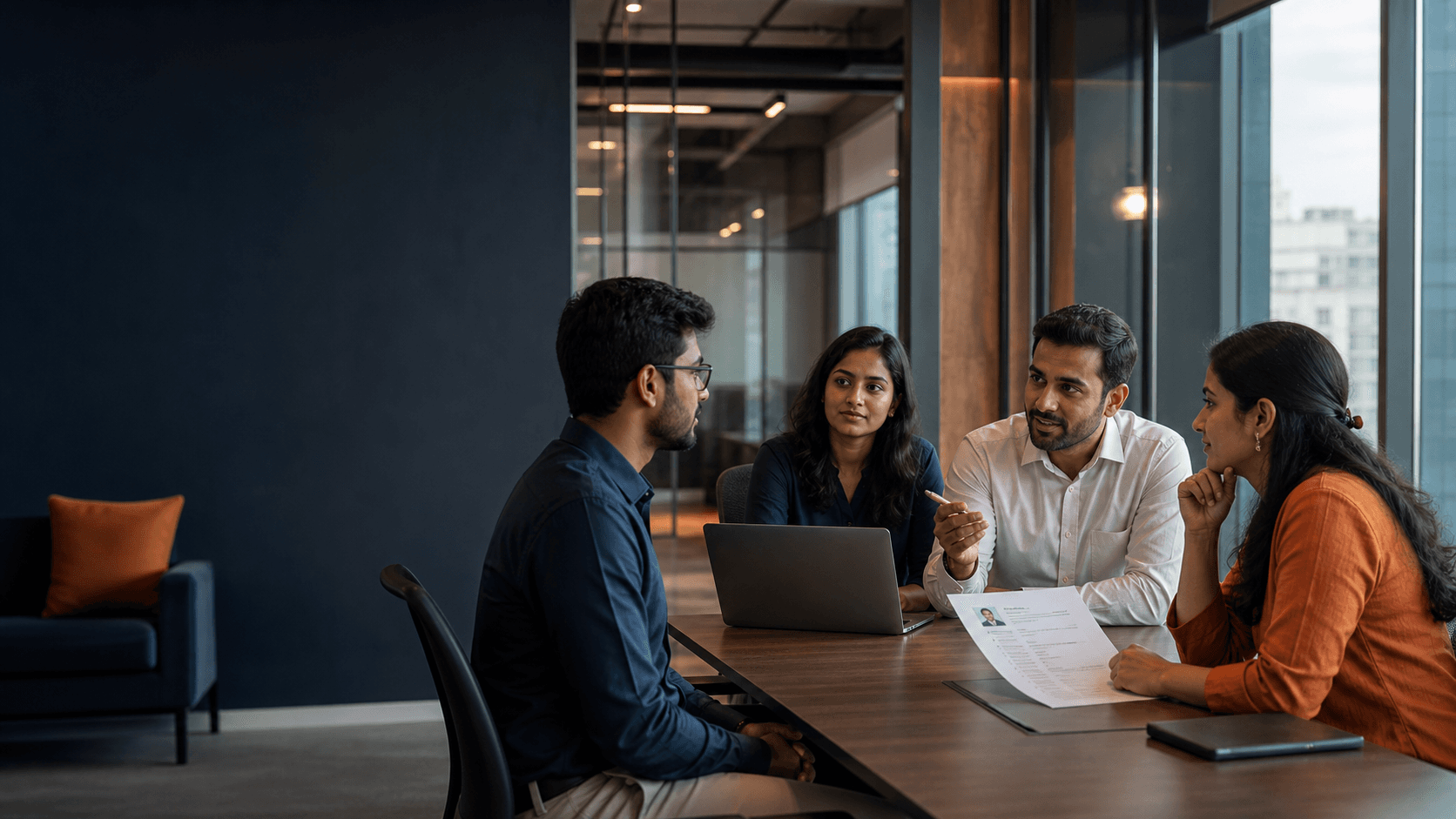 Indian technology recruiters and a candidate discussing a new role